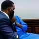 Ahmaud Arbery’s mother, Wanda Cooper, reacts next to her attorney Lee Merritt during the trial of William “Roddie” Bryan, Travis McMichael and Gregory McMichael, who are charged with the February 2020 death of 25-year-old Arbery, at the Gwynn County Superior Court, in Brunswick, Ga., Friday, Nov. 5, 2021.